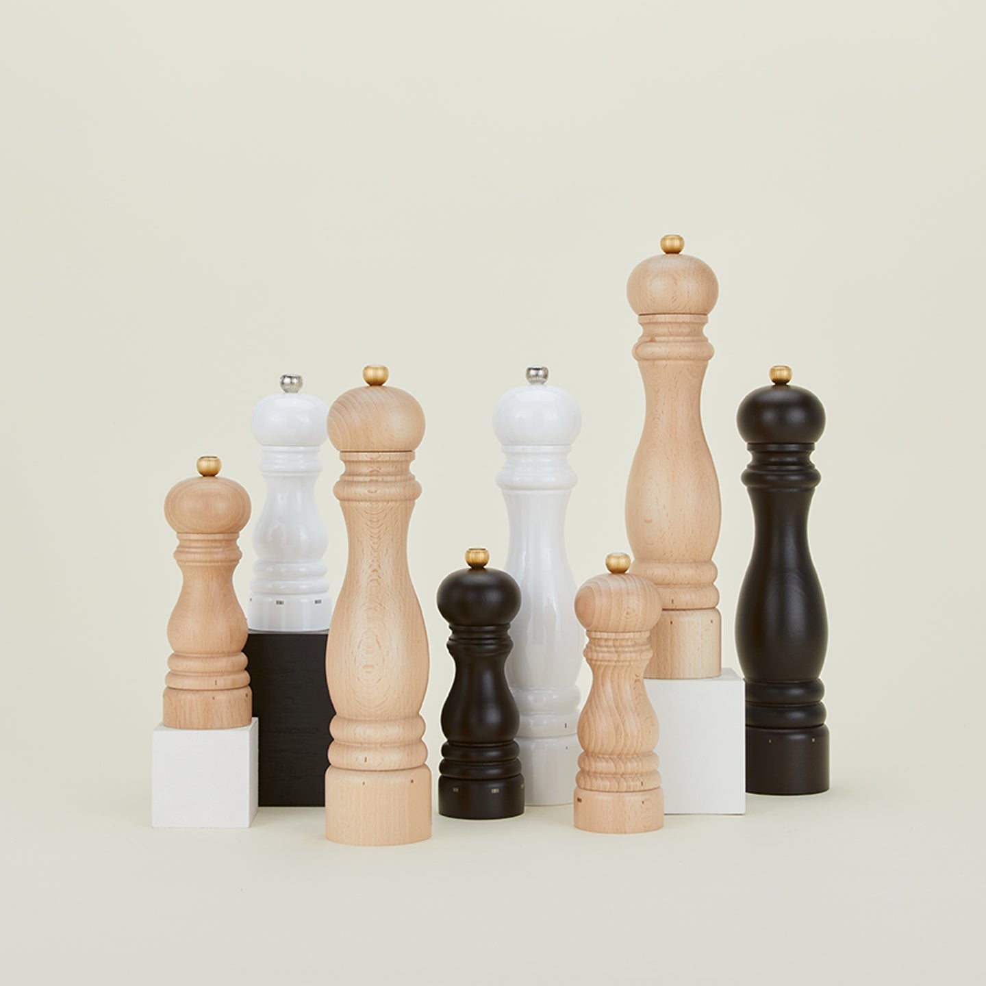 Group of Classic Salt & Pepper mills in black, white and beech.