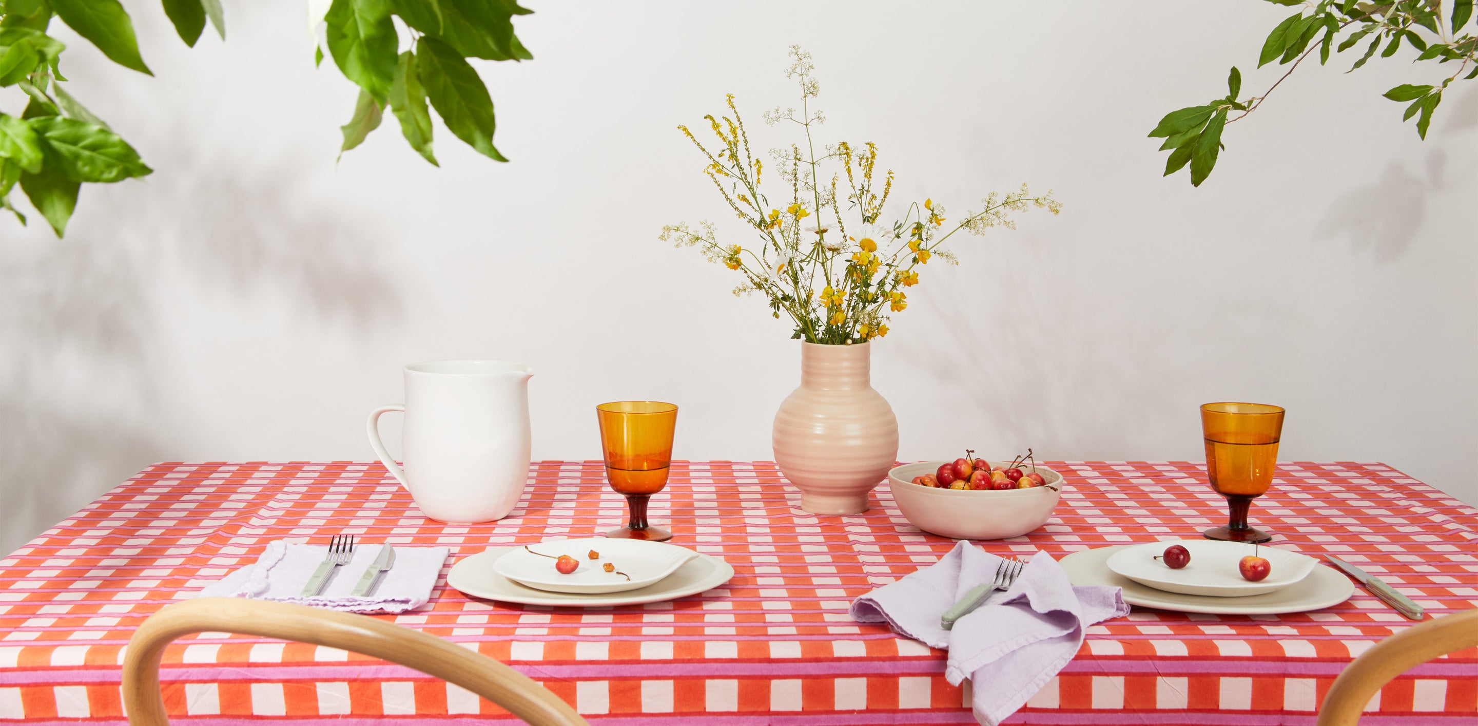 Maximalist table setting with ceramic dinnerware. 