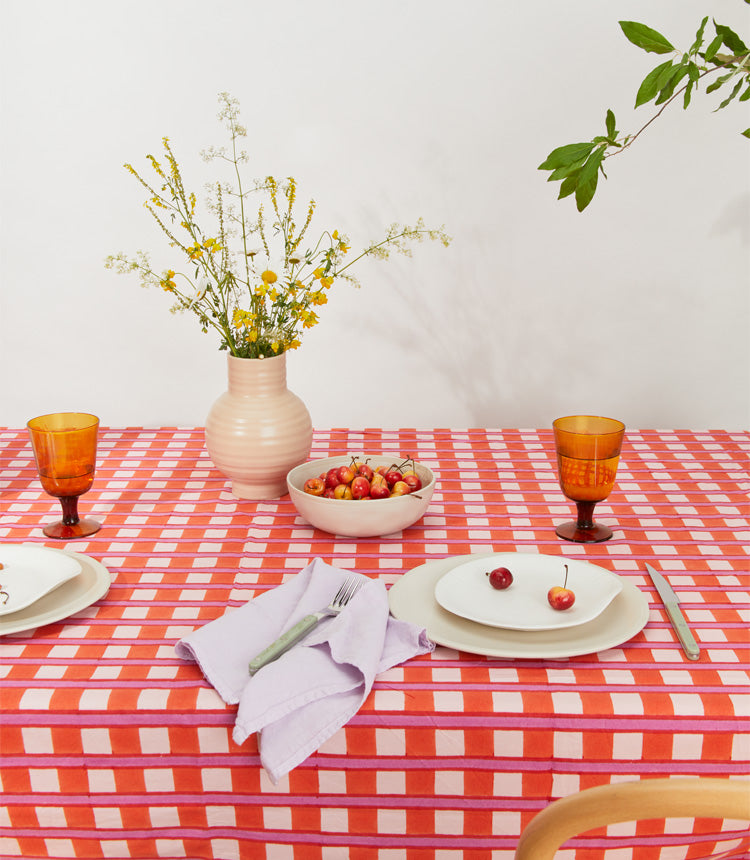 Maximalist table setting with ceramic dinnerware. 