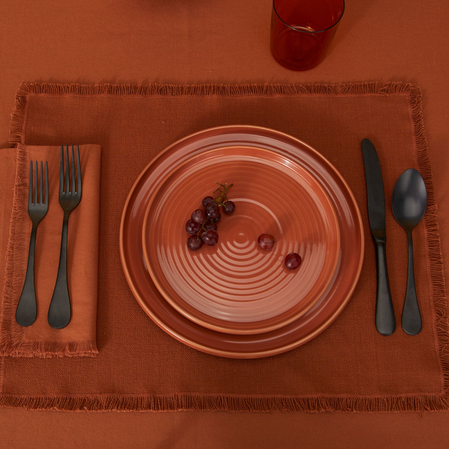 Essential Cotton Placemat in Terracotta with place setting.