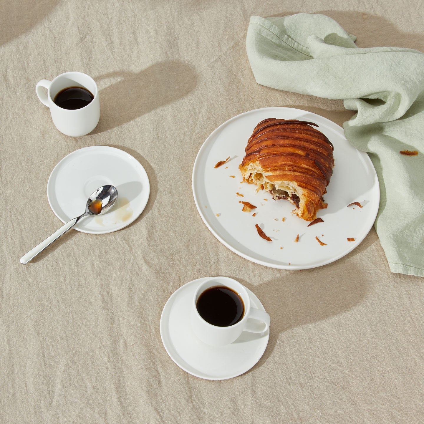 Simple Porcelain Espresso Mugs with spoon, pastry on plate, and Simple Linen Napkin in Sage.