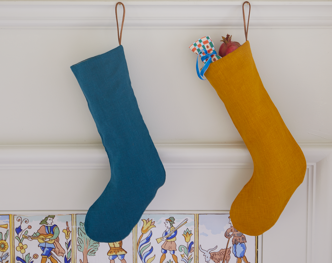 Blue and yellow stockings hung from a mantel