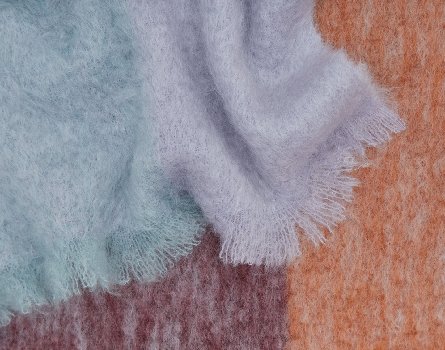 Close-up detail of fringed mohair throw.