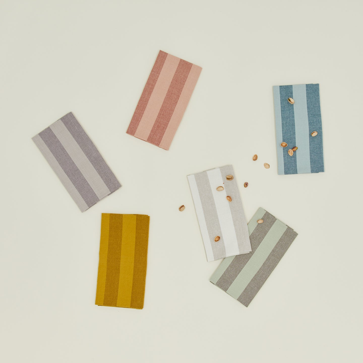 Group of Essential Striped Dinner Napkins in various colors.