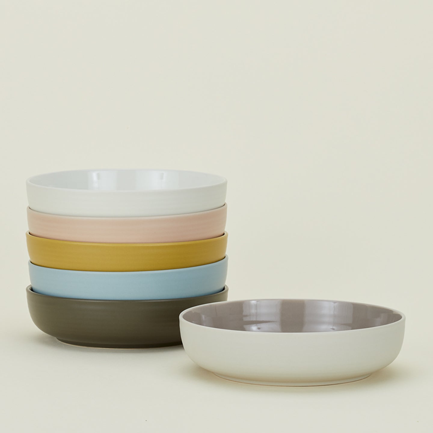 Stack of Essential Low Bowls in various colors.