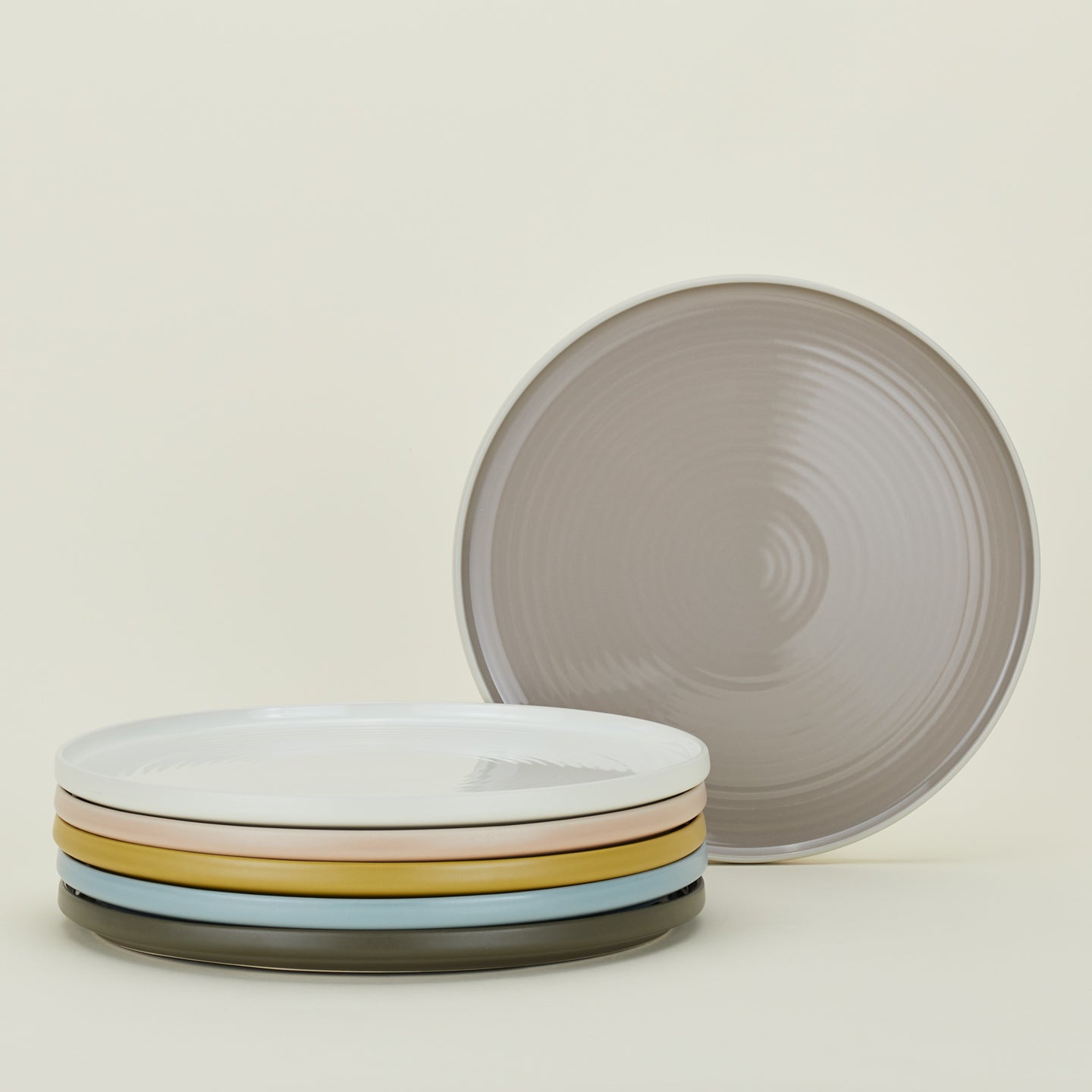 Stack of Essential Serving Platters in various colors.