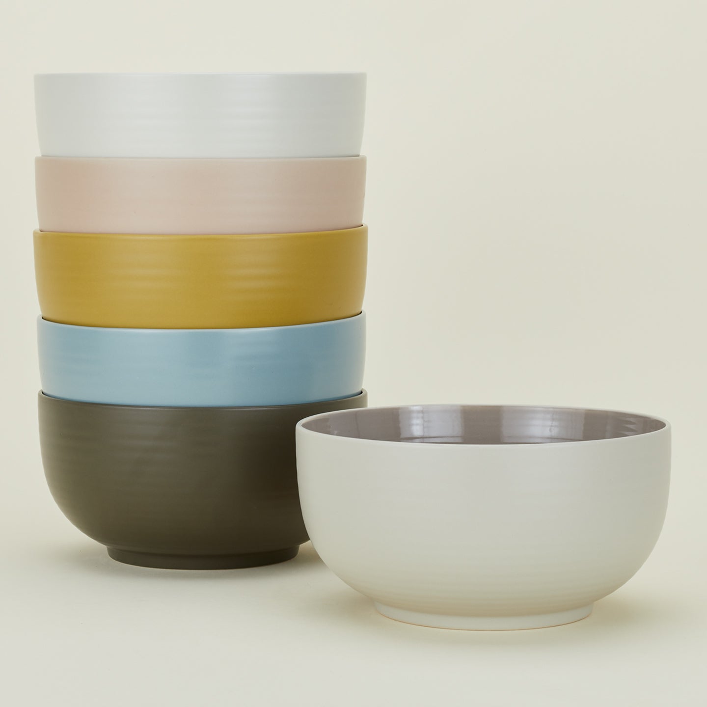 Stack of Essential Serving Bowls in various colors.