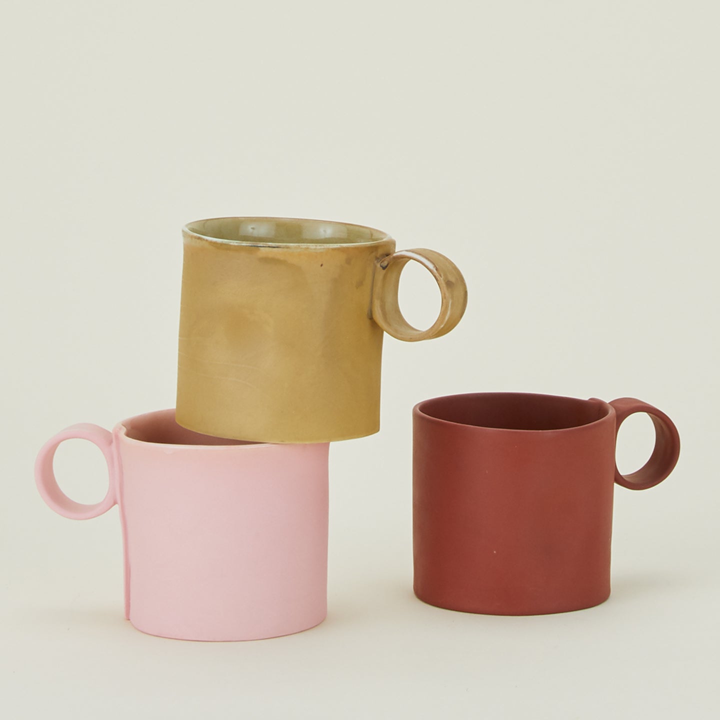 Group of Loop Handled Mugs in various colors.