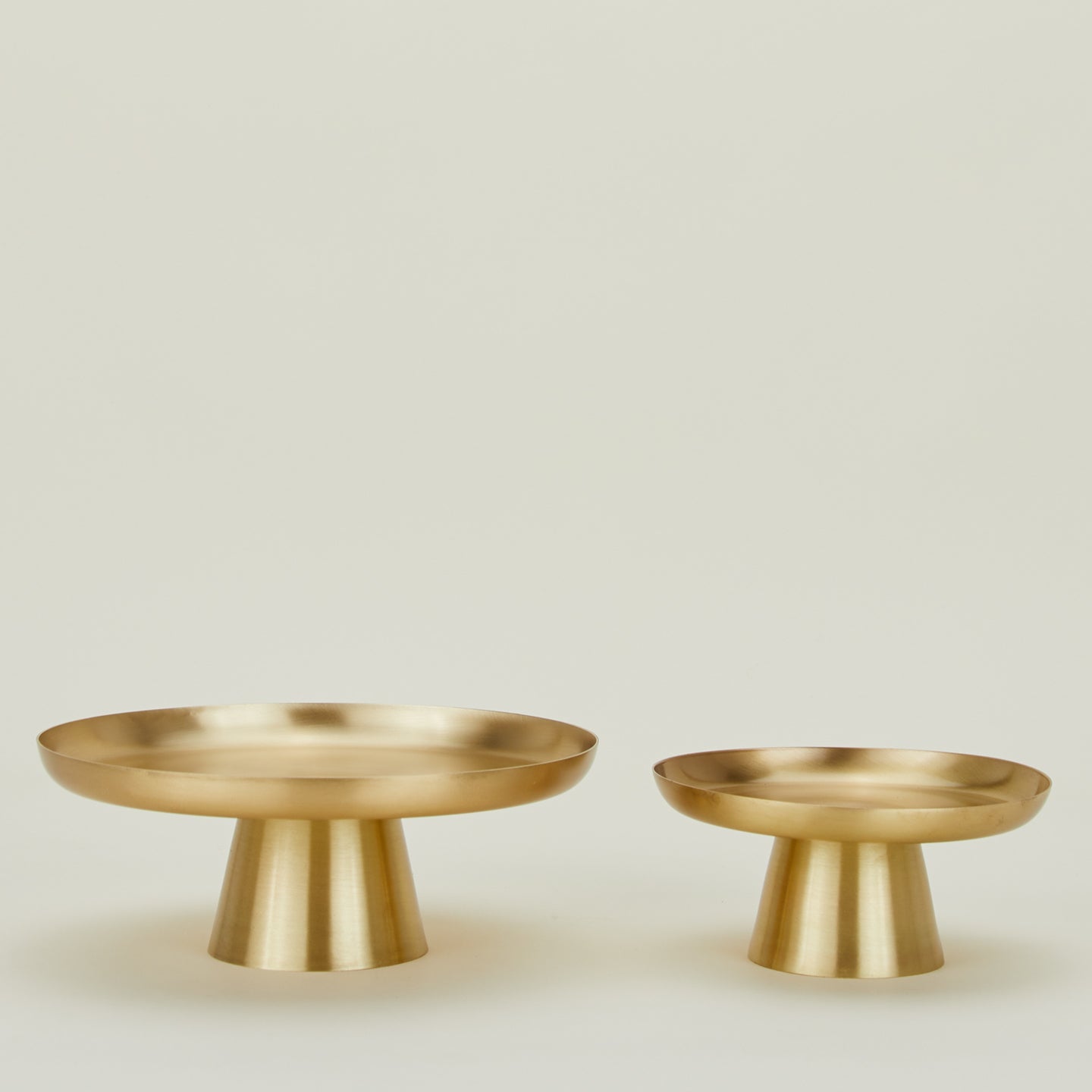 Two Brass Cake Stands in various sizes.