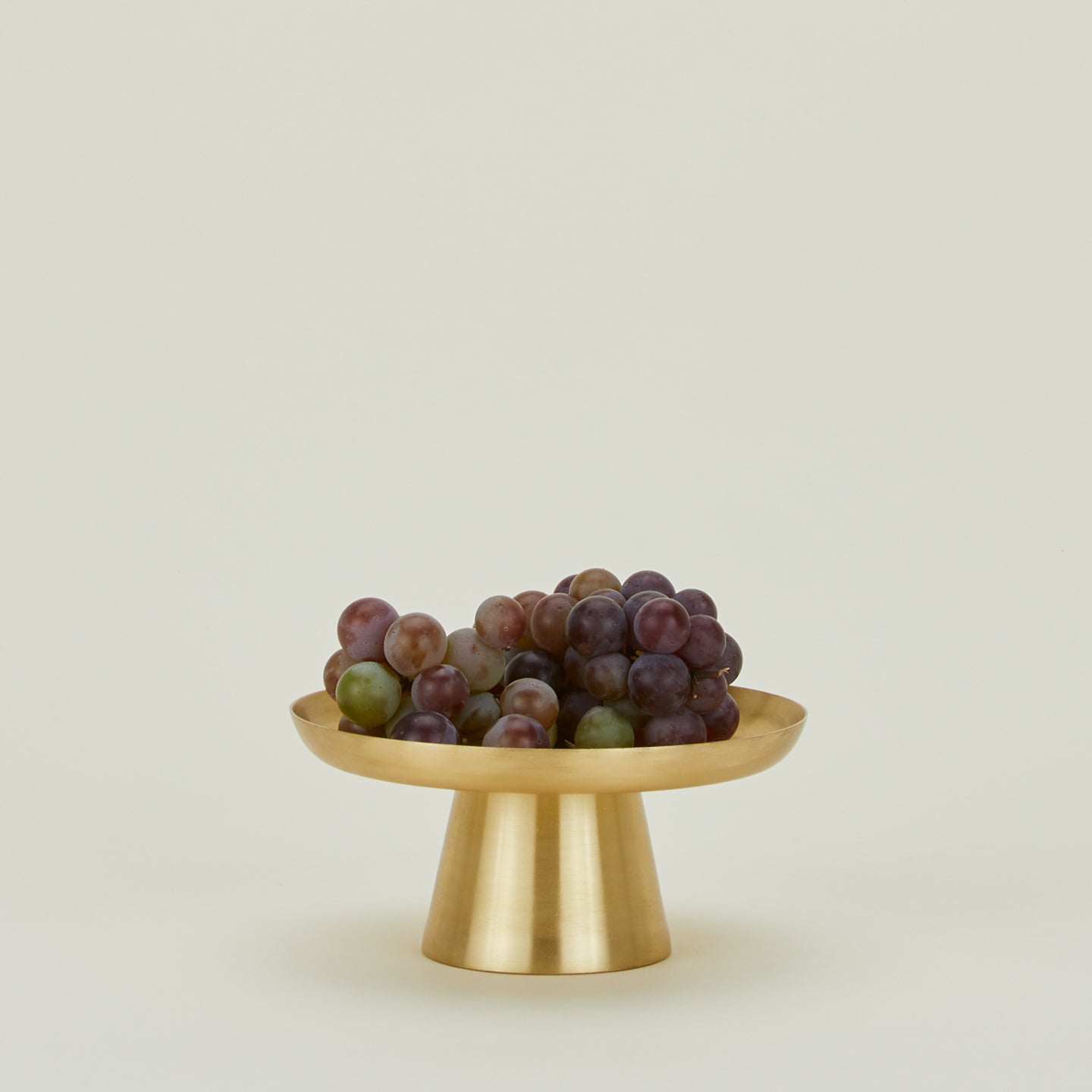 Brass Cake Stand in Small, with bunch of grapes.