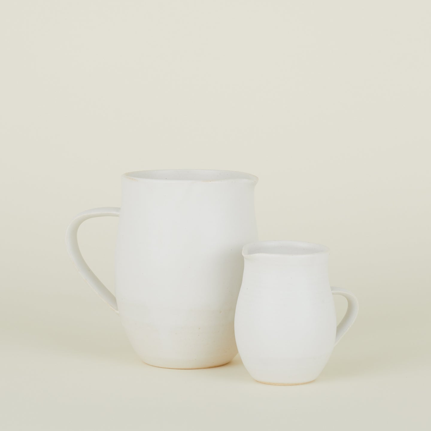 Stoneware Creamer and Stoneware Pitcher in Eggshell.