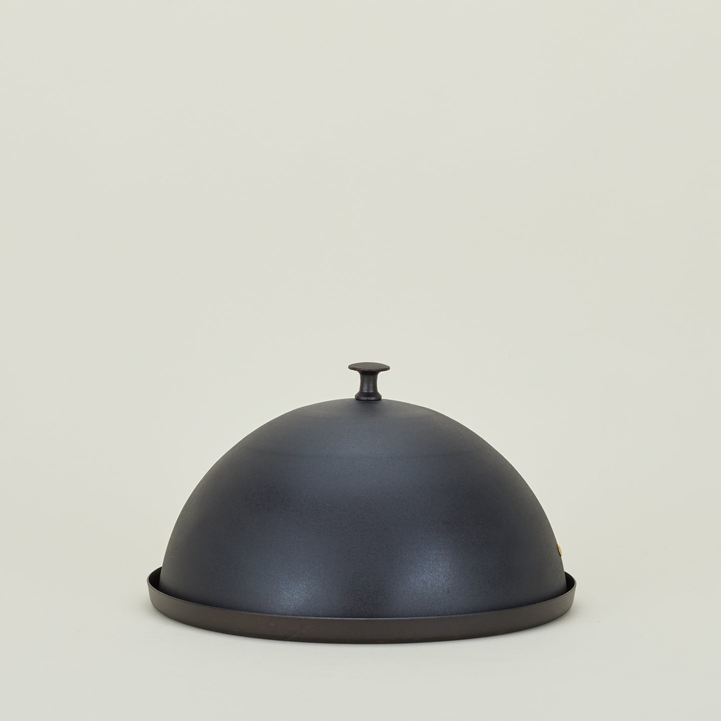 Spun iron cloche with base