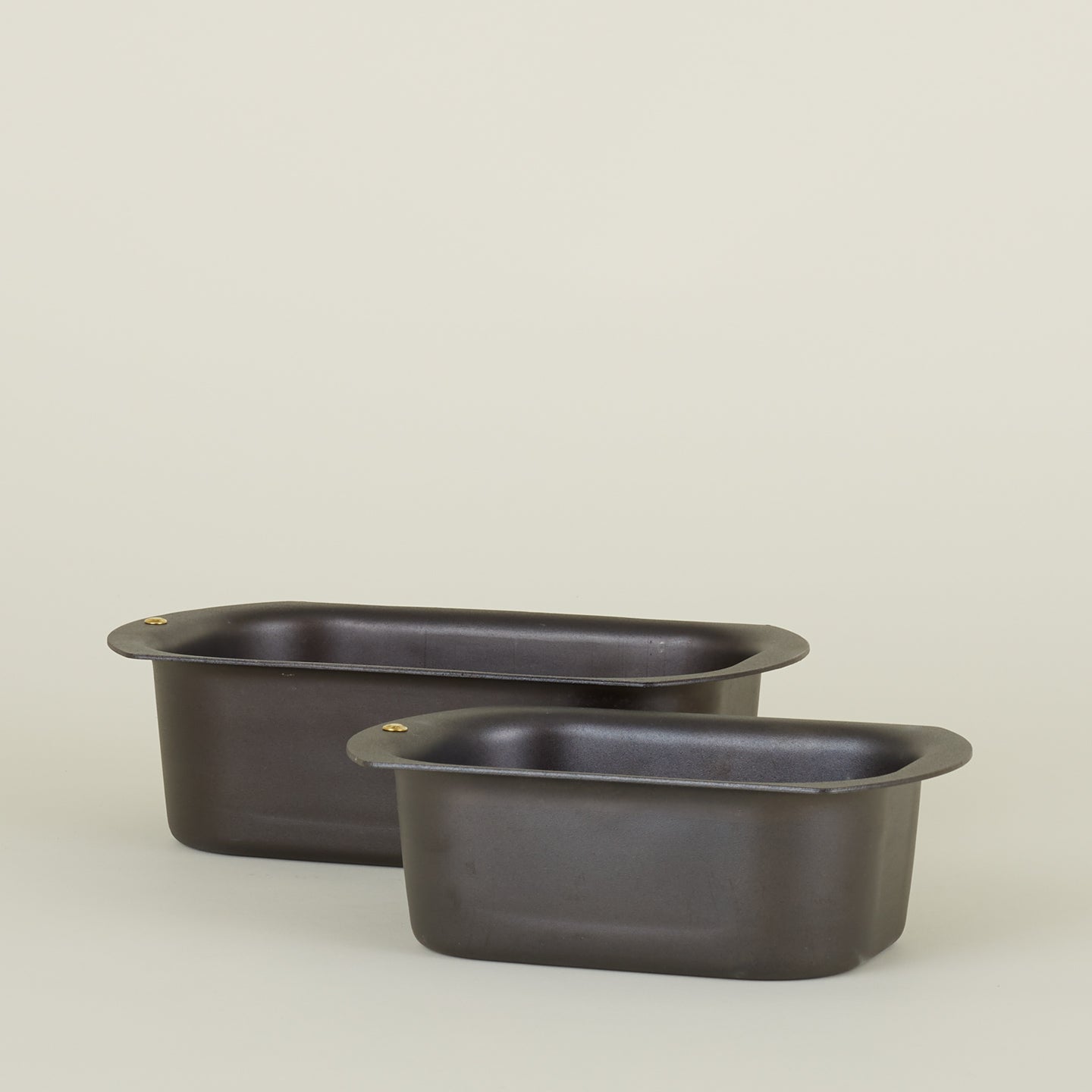 Large and small spun iron loaf pans