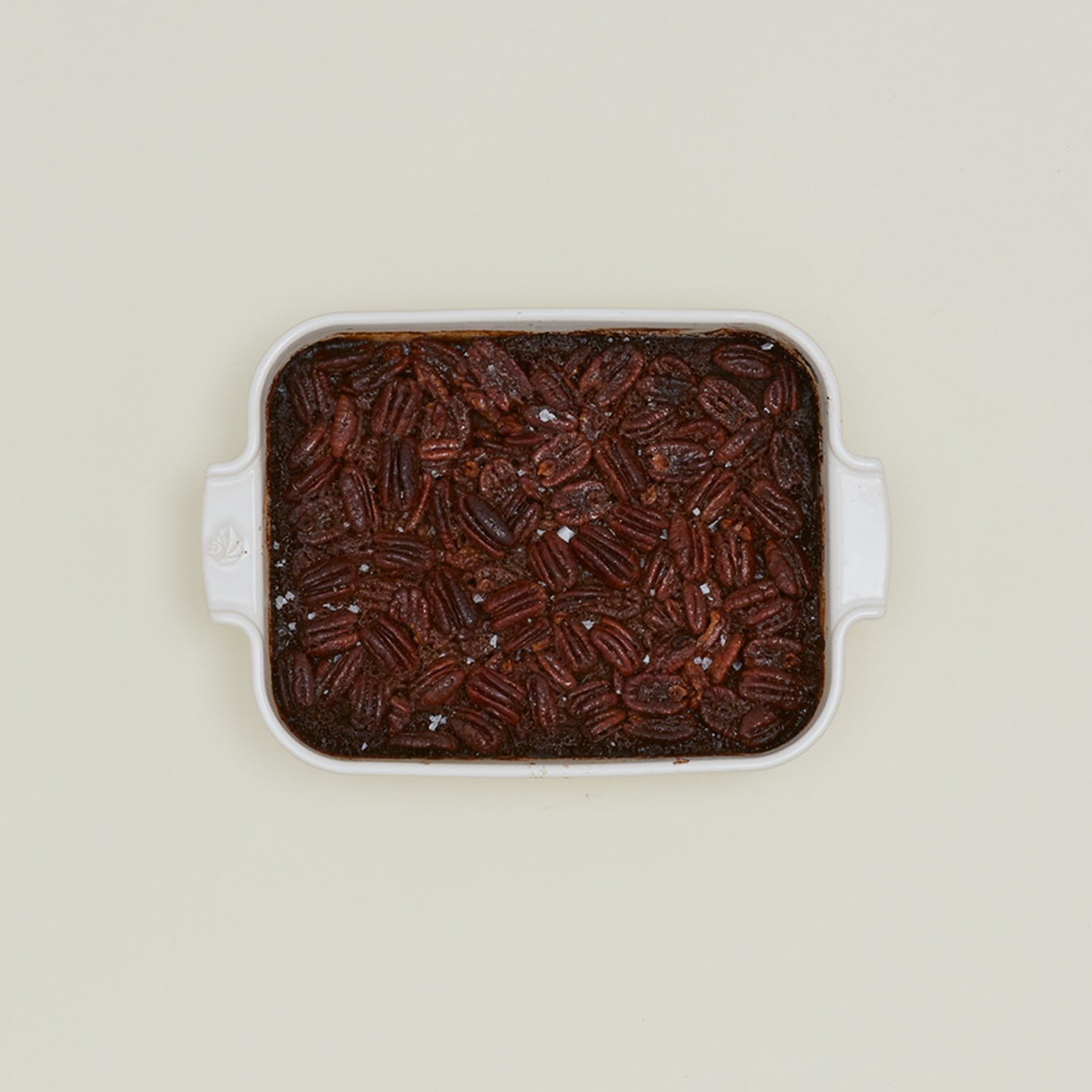 Rectangular baking dish with pecans