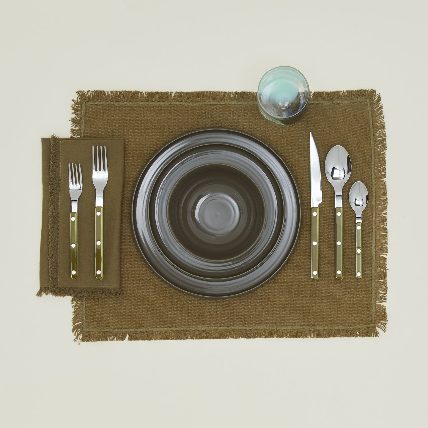 Placesetting with Bistrot Flatware in Forest Green.