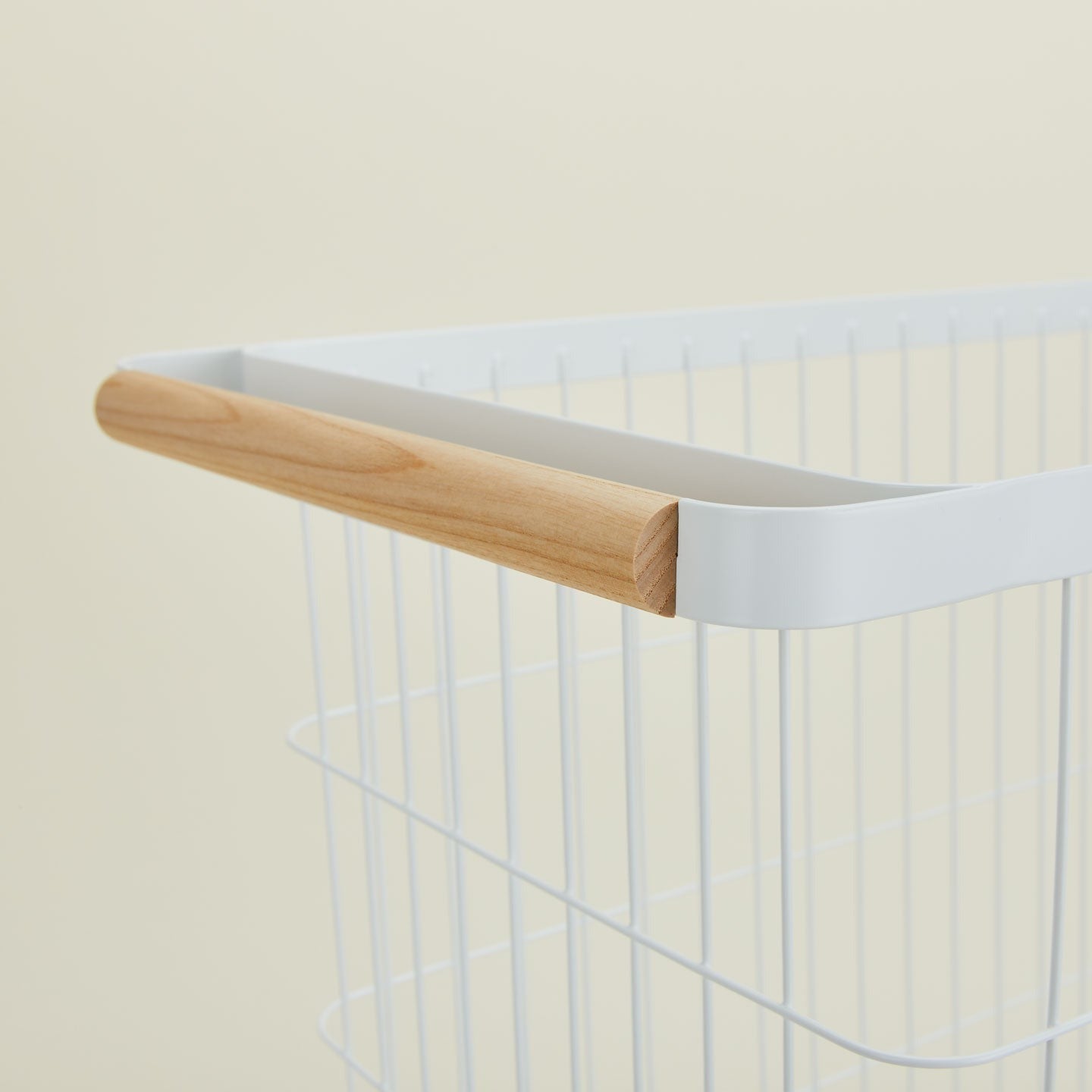 A  modern slim rolling laundry basket.