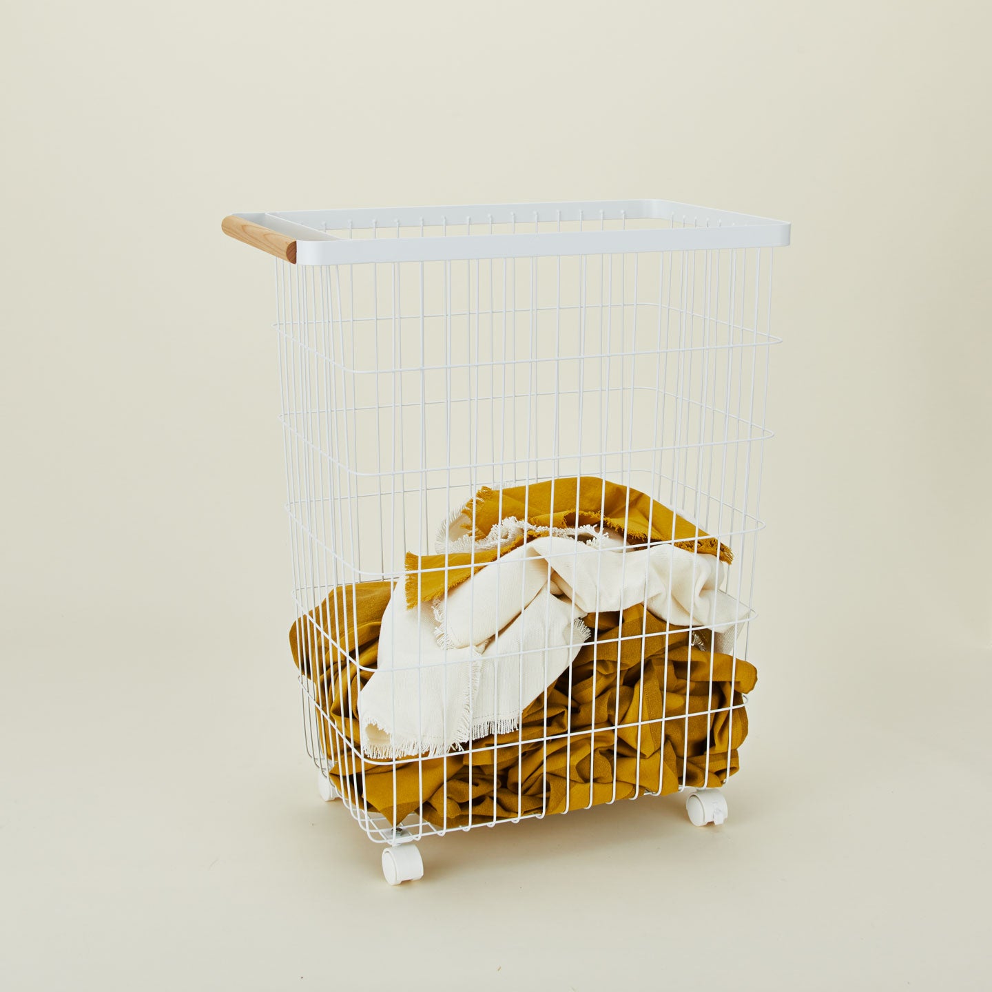 A  modern slim rolling laundry basket.