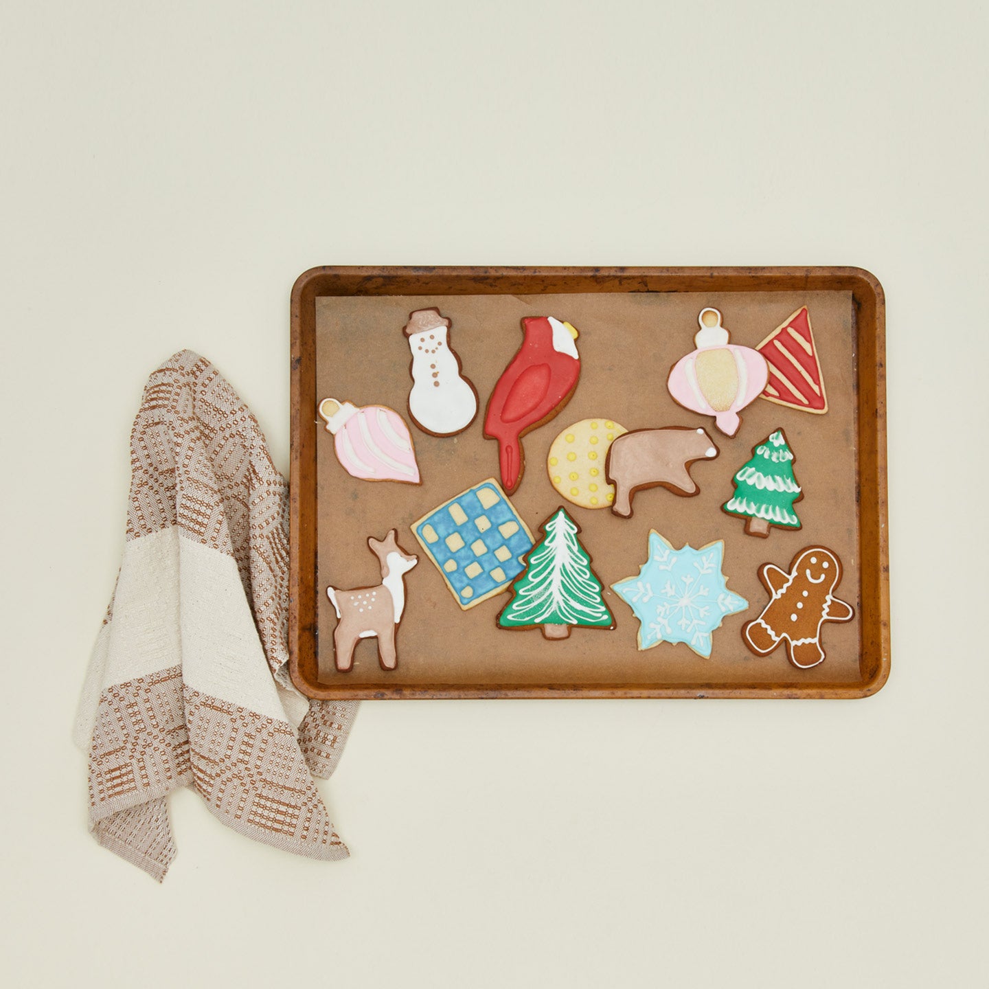 Cookies on tray with kitchen towel