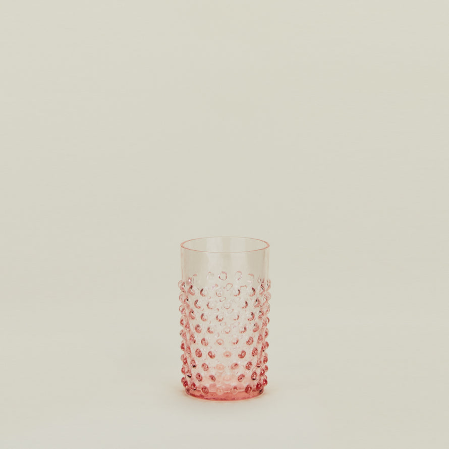 Textured blush glass tumbler.