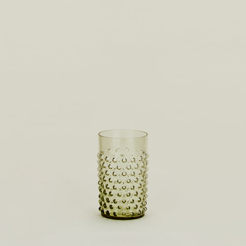 Textured olive glass tumbler.