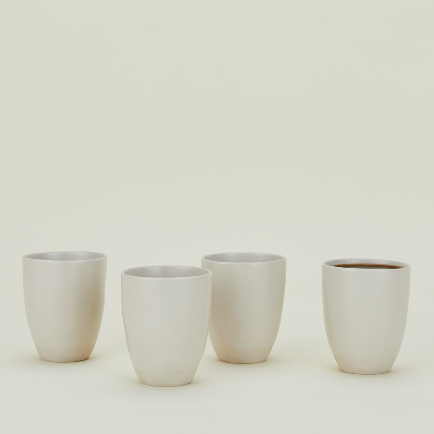 Four Atelier Mugs.