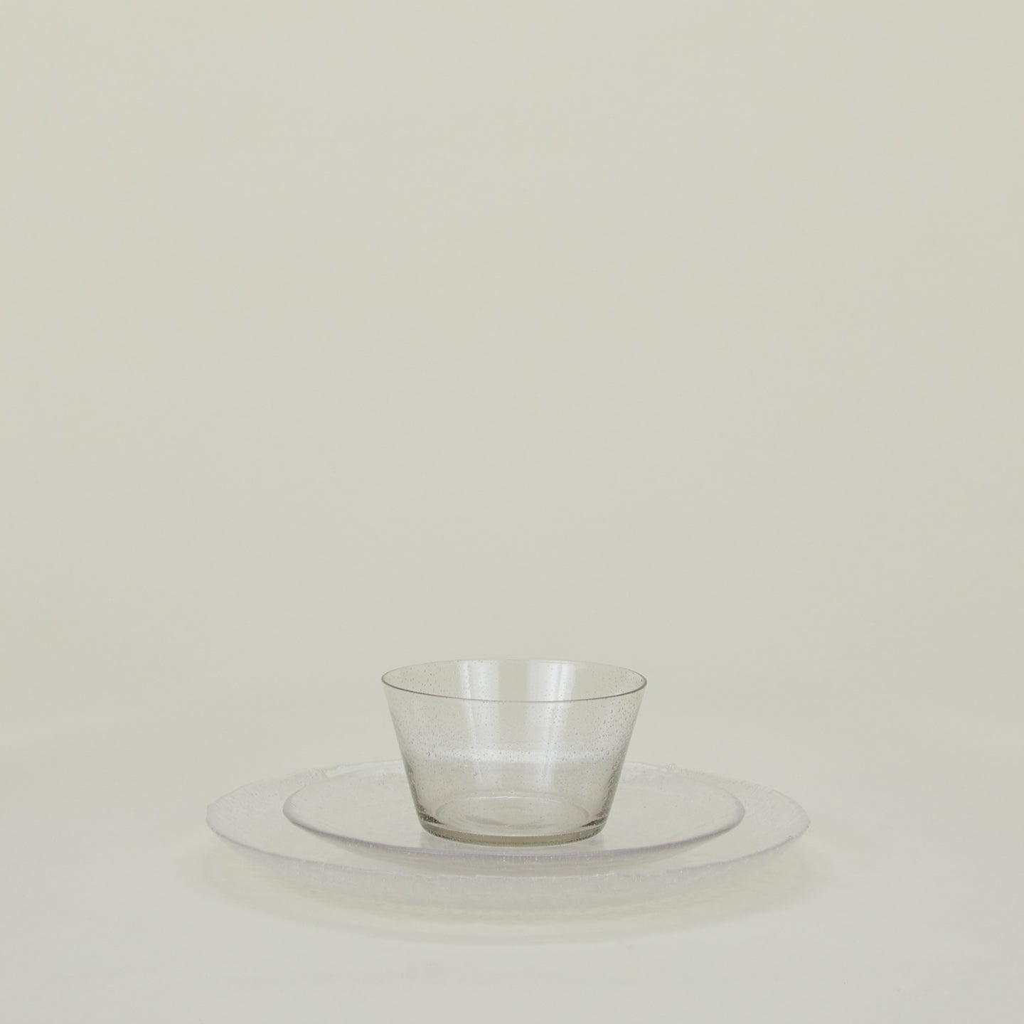 Group of Clear glass salad plate, dinner plate and bowl.