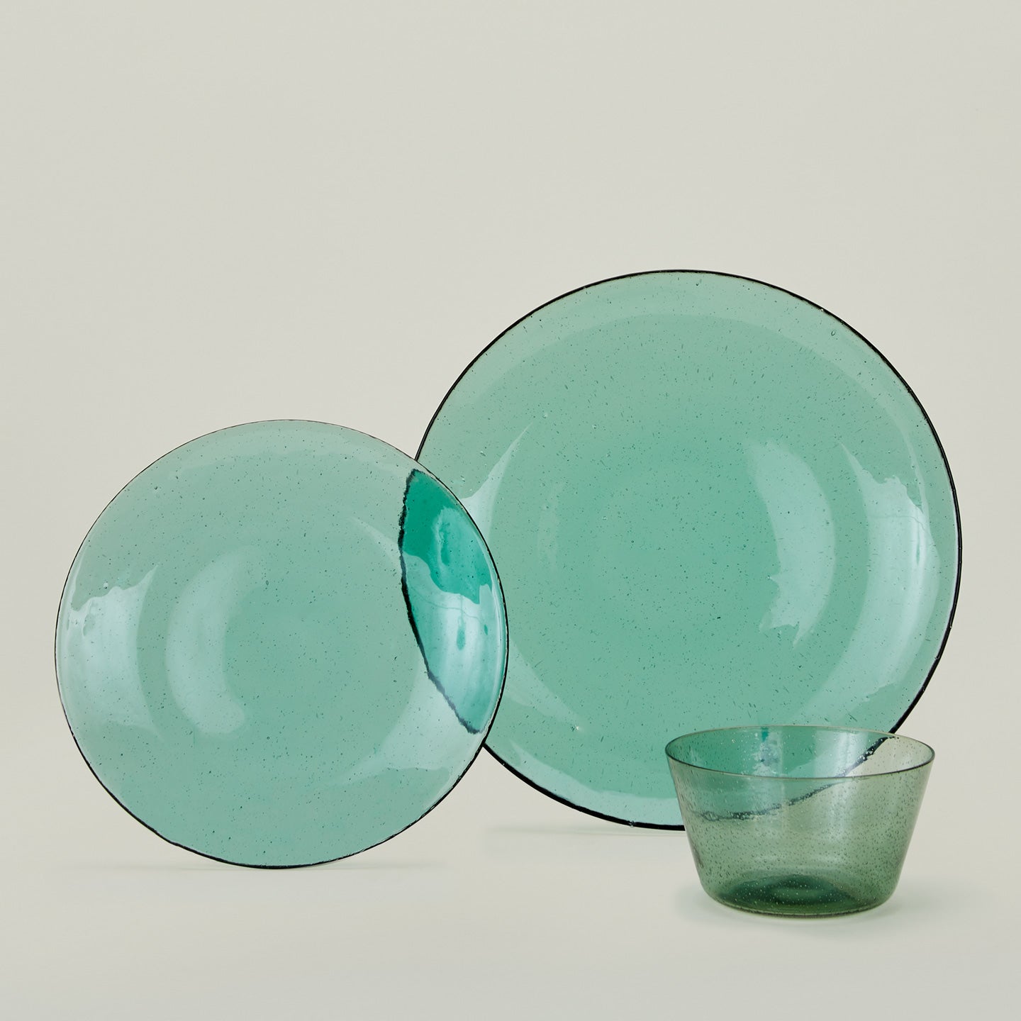 Group of Jade glass salad plate, dinner plate and bowl.