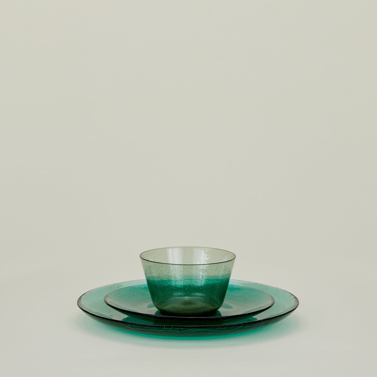 Group of Jade glass salad plate, dinner plate and bowl.