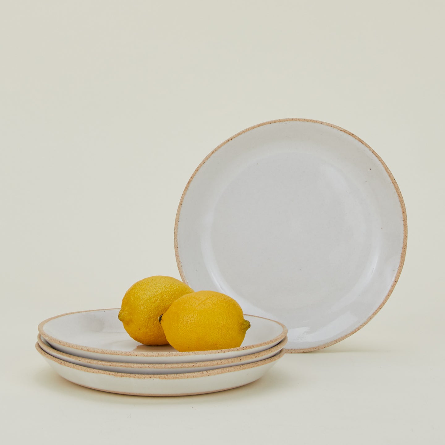 Four Minimal Salad Plates with lemons.