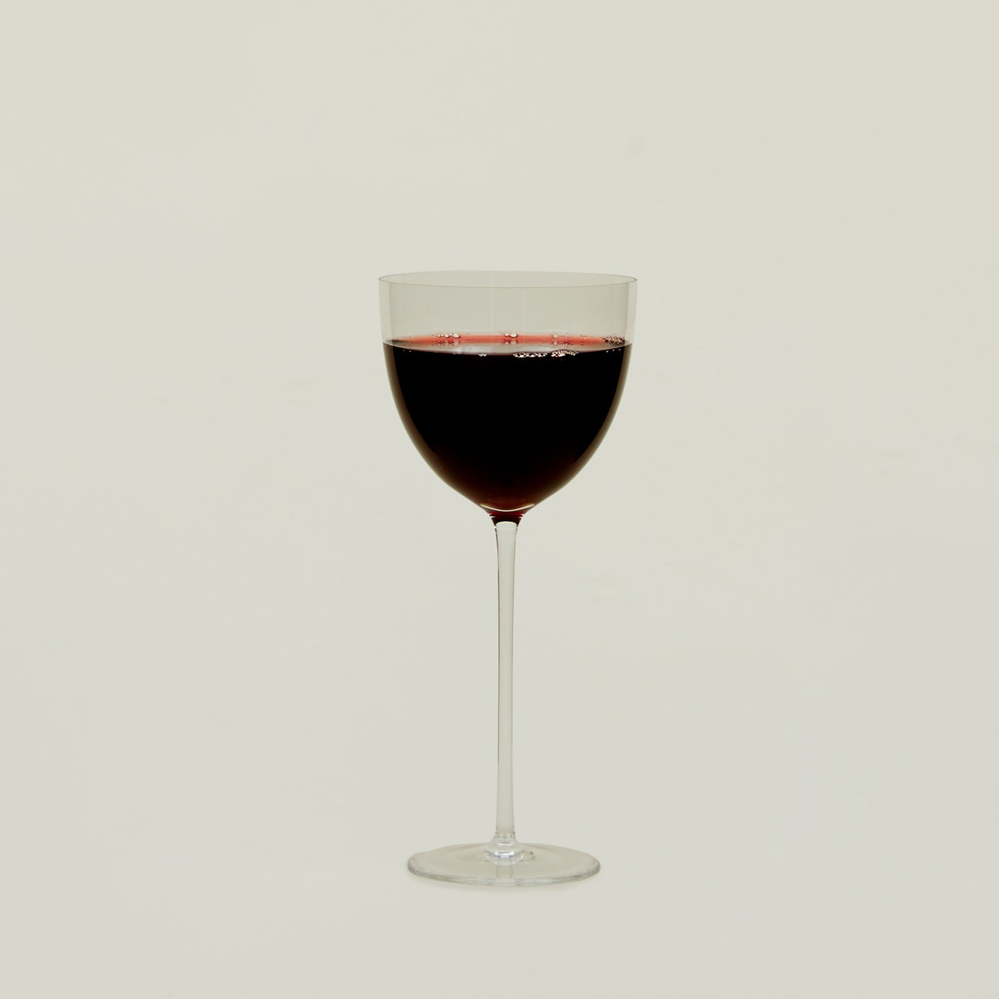 Crystalline Wine Glass filled with red wine.