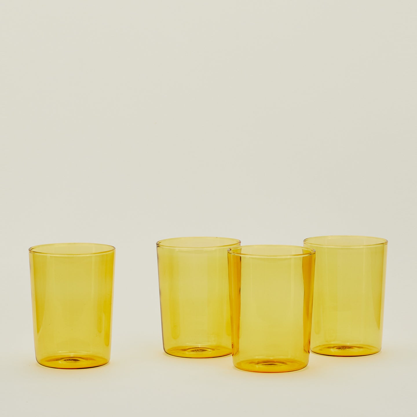 Four Large Essential Glasses in Amber.