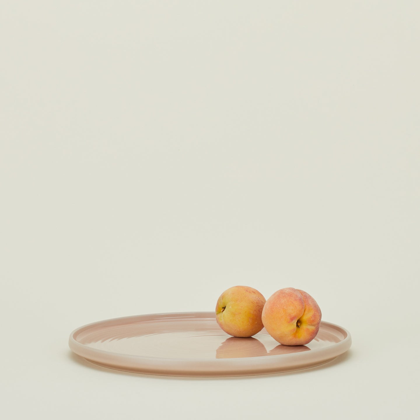 Essential Serving Platter in Blush with peaches.