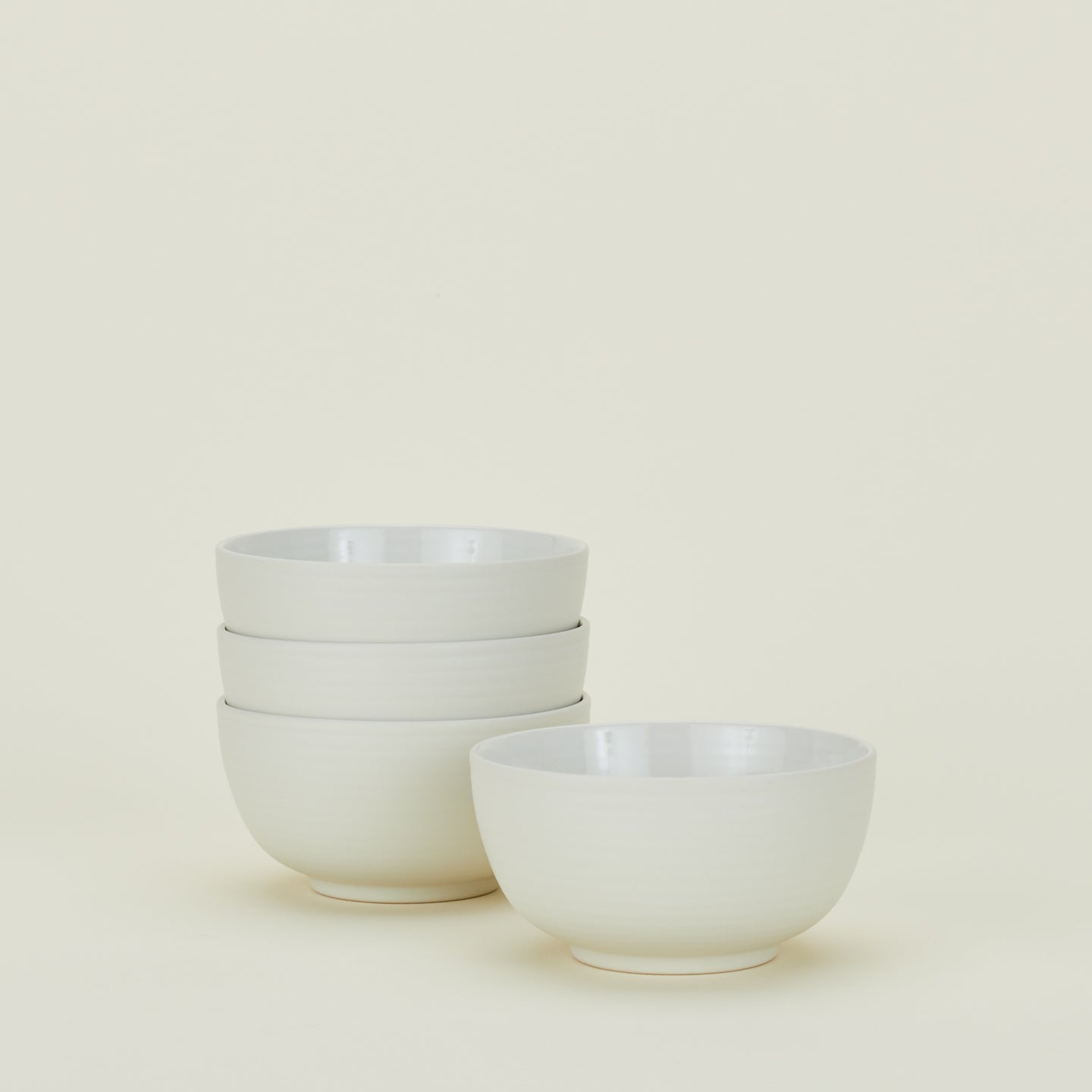 Four bone white Essential Large Bowls.