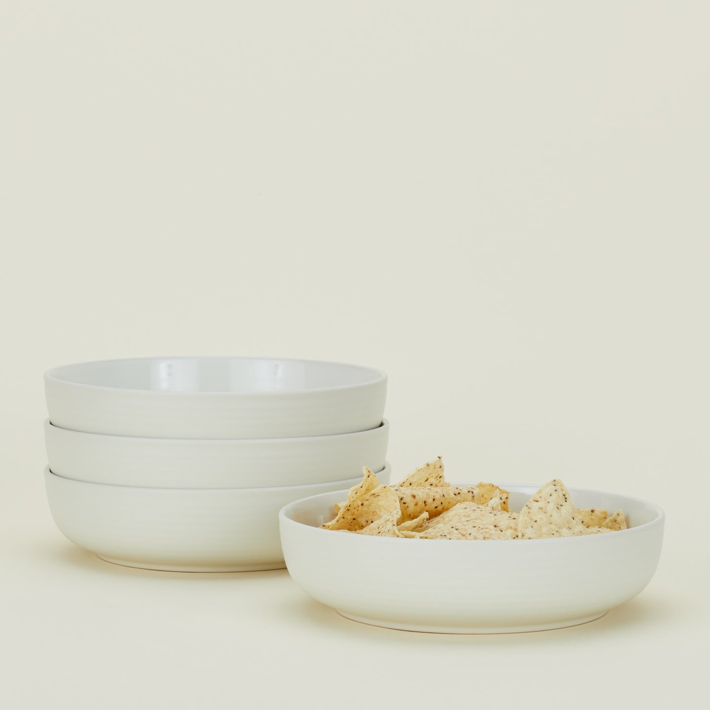 Four Essential Low Bowls in Bone, with tortilla chips.