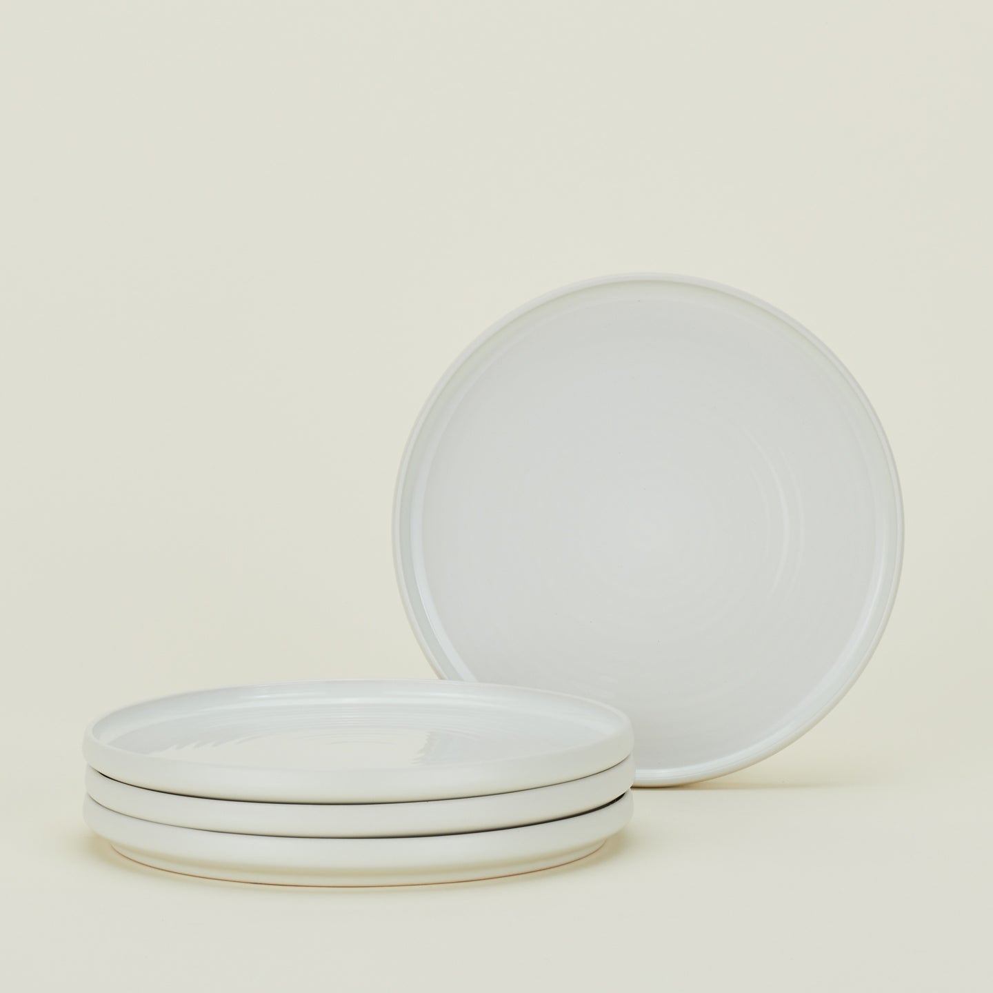 Four bone white Essential Salad Plates.