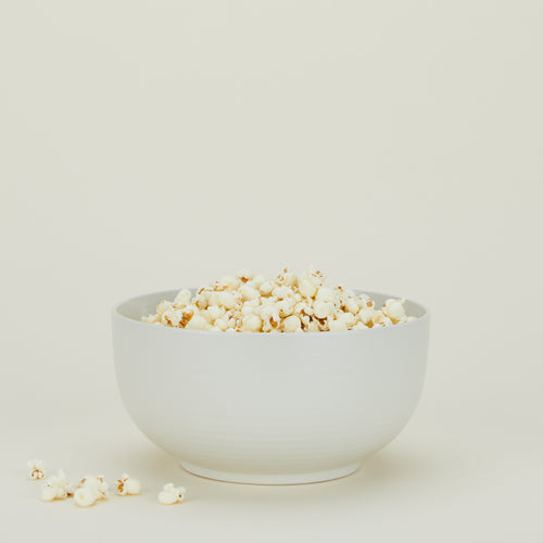 Essential Serving Bowl in Bone with popcorn.