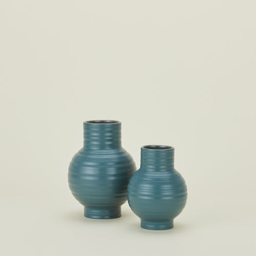 Large and small essential ceramic vase in peacock