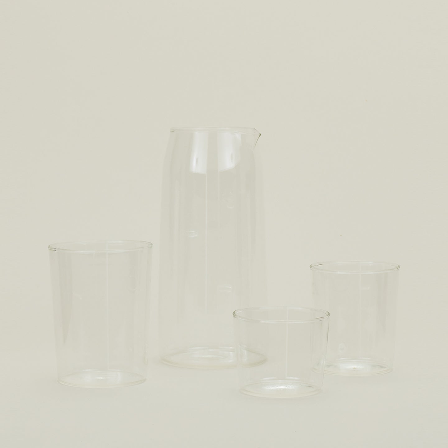 Small, Medium and Large Essential Glasses with Essential Glassware Pitcher in Clear.