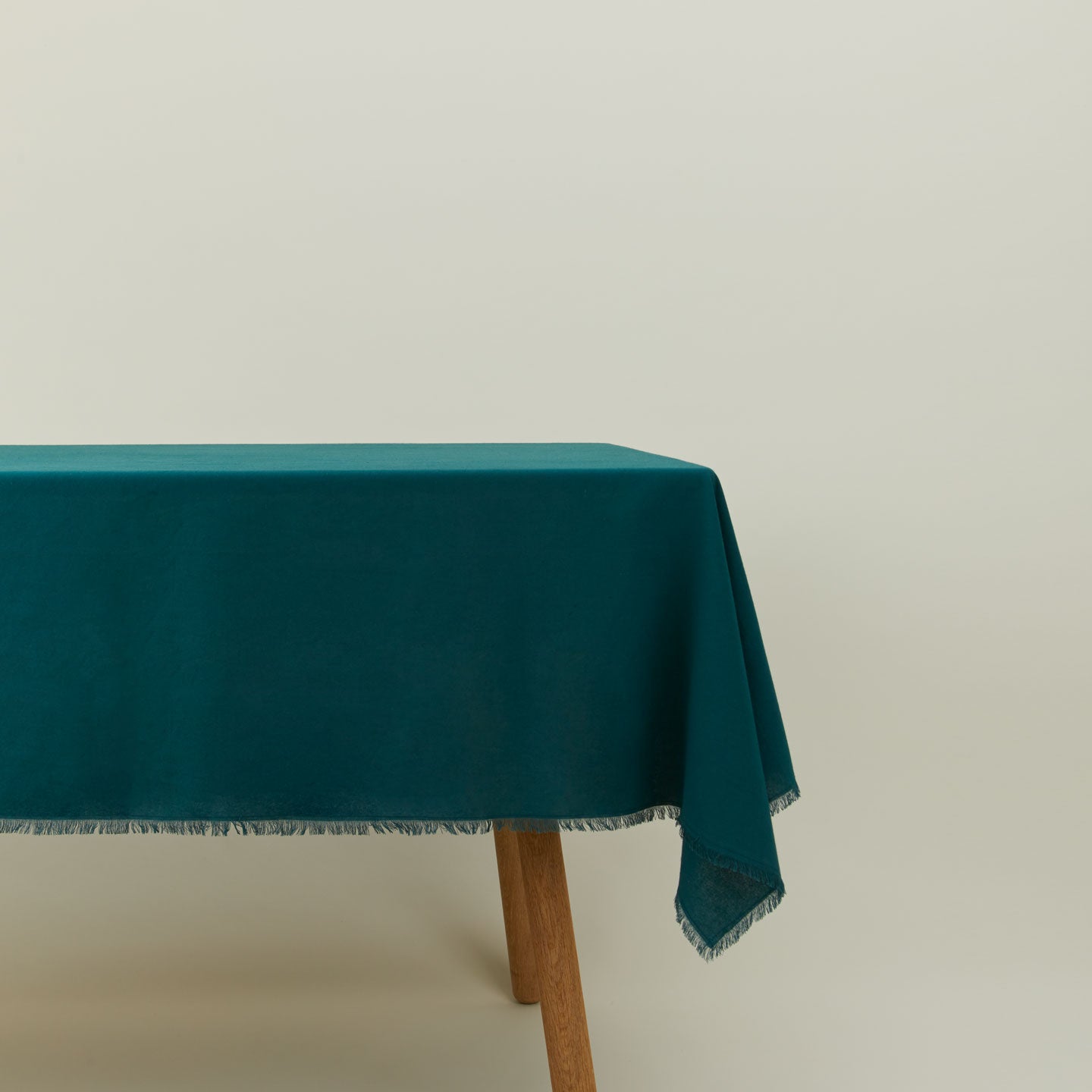 Essential cotton tablecloth in Peacock on table.