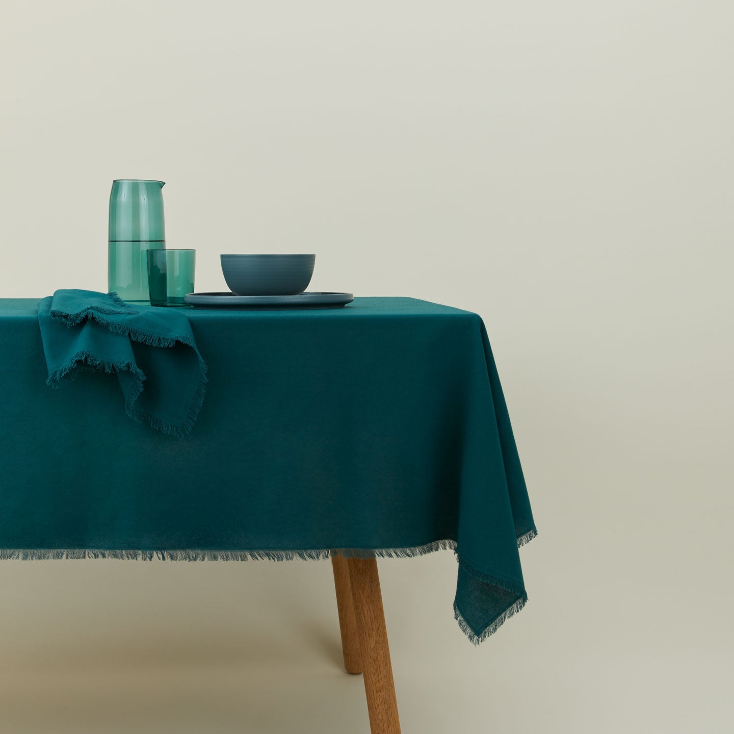 Essential cotton tablecloth in Peacock on table.