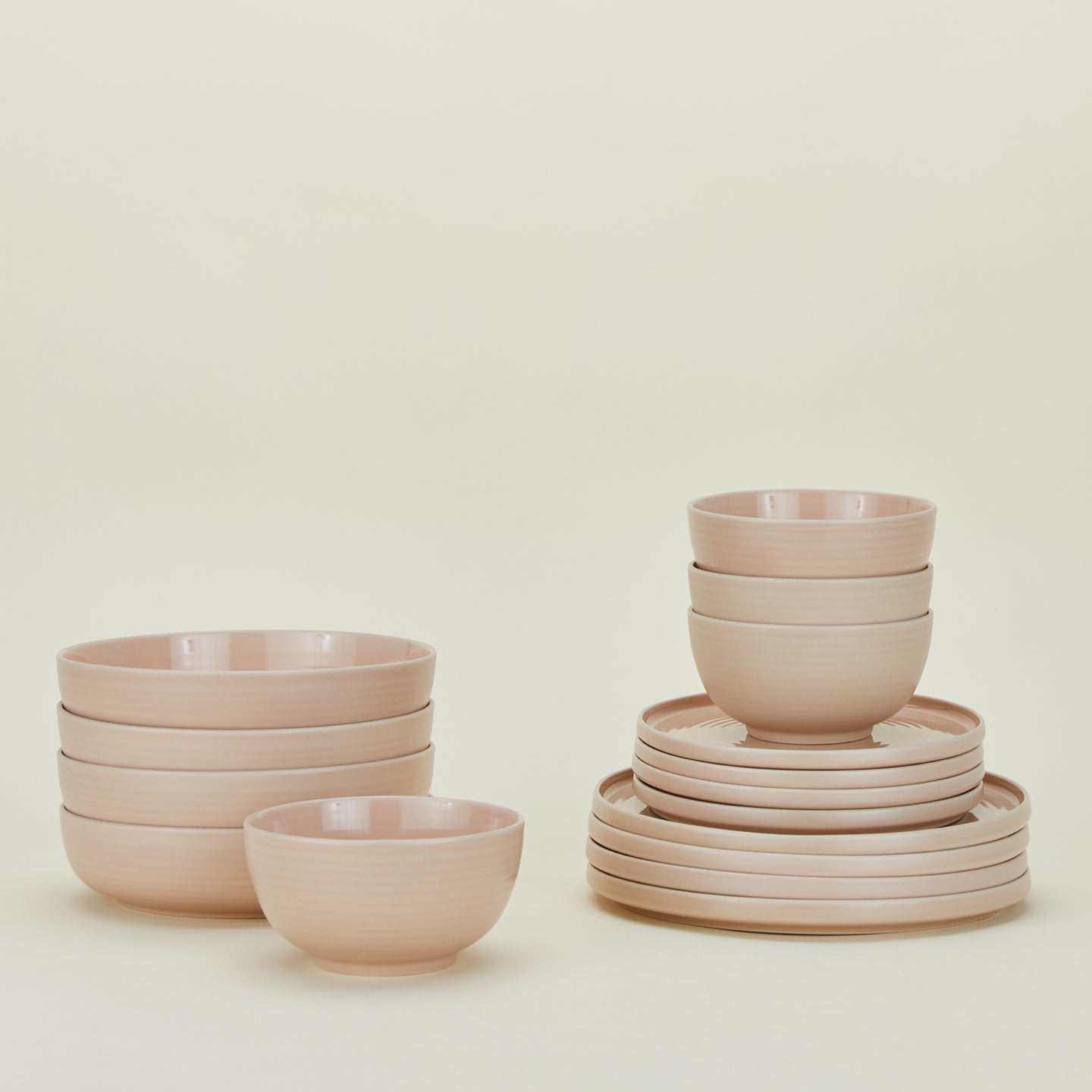 Set of blush pink Essential dinnerware including Large Bowls, Low Bowls, Salad Plates and Dinner Plates.