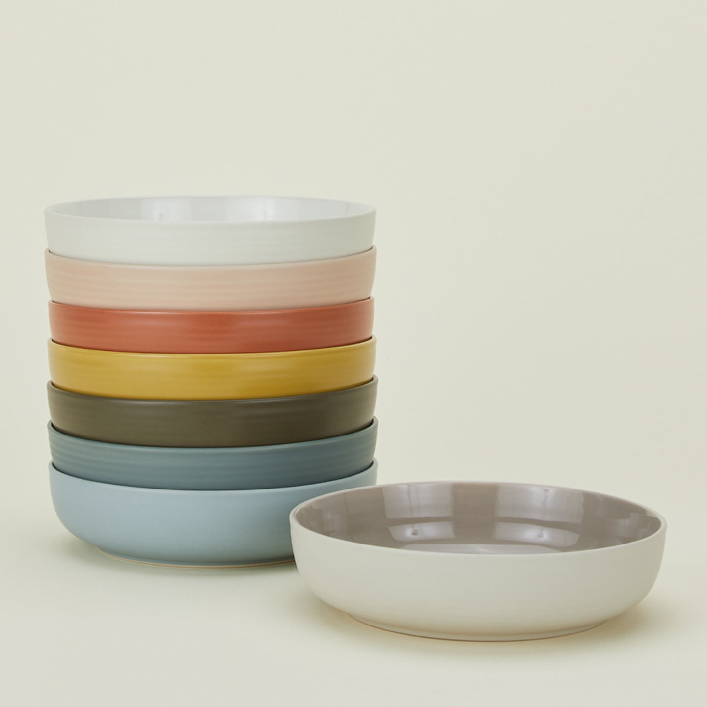 Stack of Essential Low Bowls in various colors.