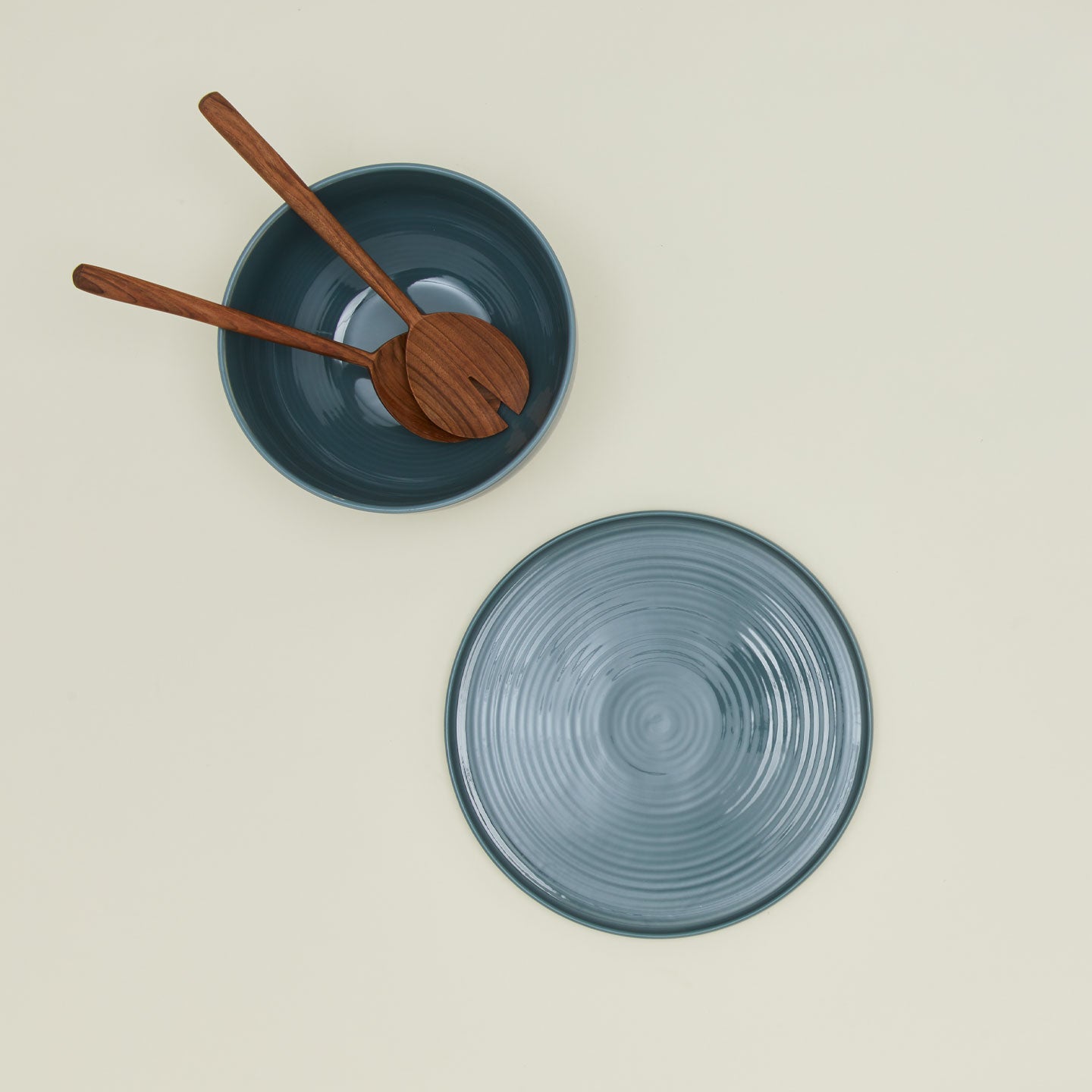 Overhead view of essential serveware set with wooden utensils