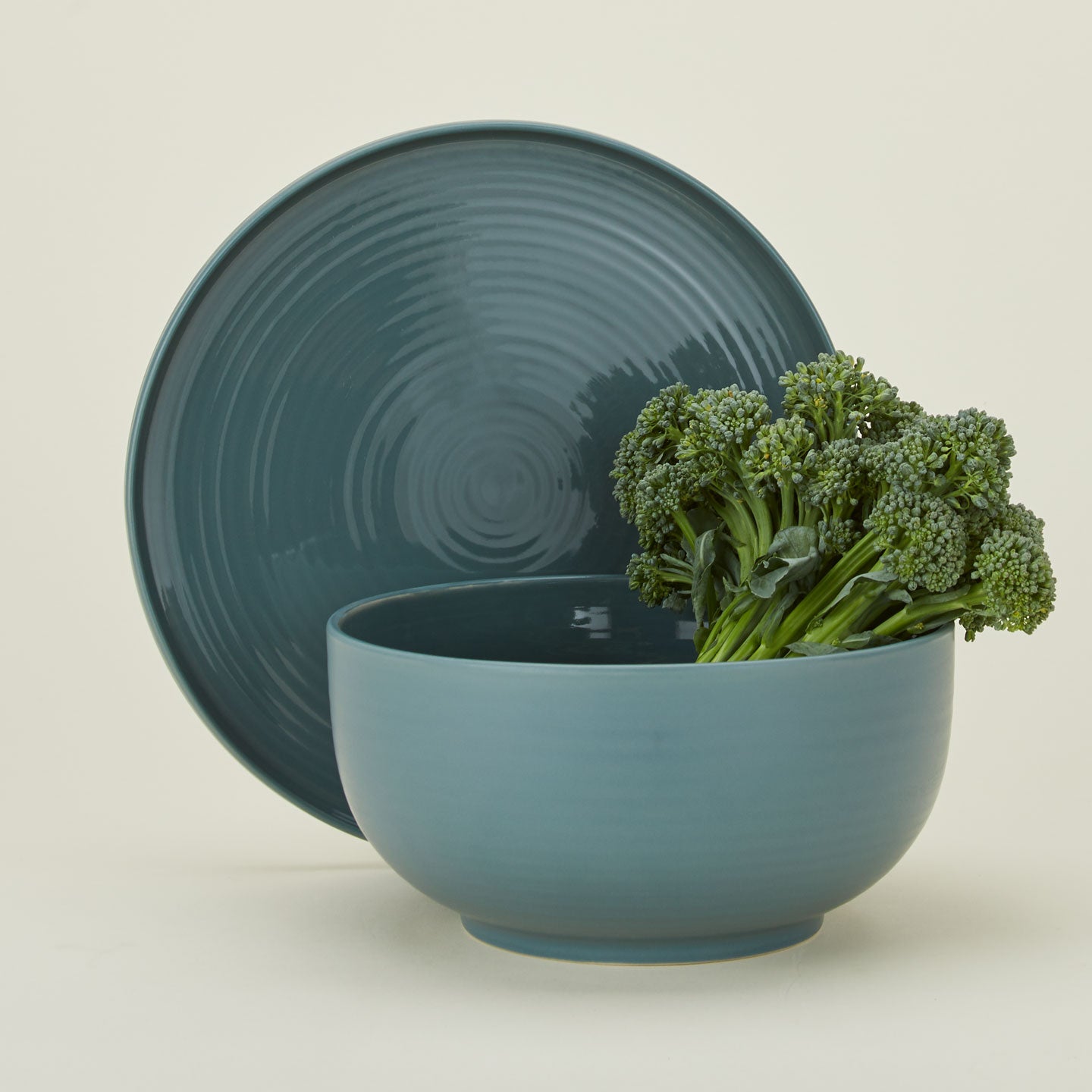 Essential serveware serving set with platter and serving bowl in peacock with broccoli