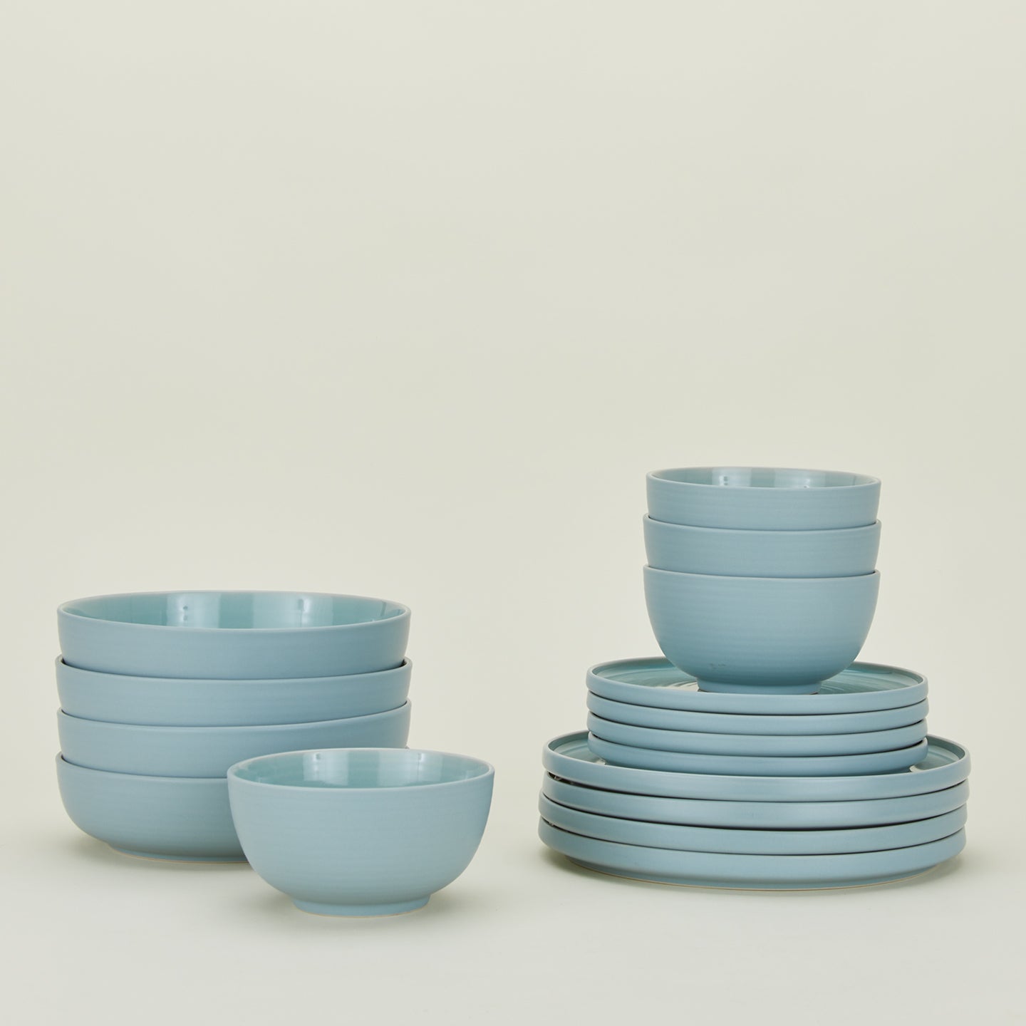 Set of sky blue Essential dinnerware including Large Bowls, Low Bowls, Salad Plates and Dinner Plates.