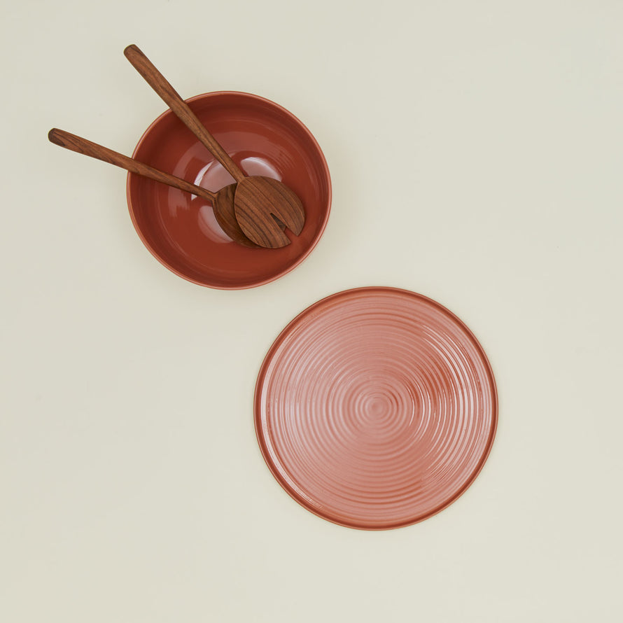 Overhead view of essential serveware set with wooden utensils