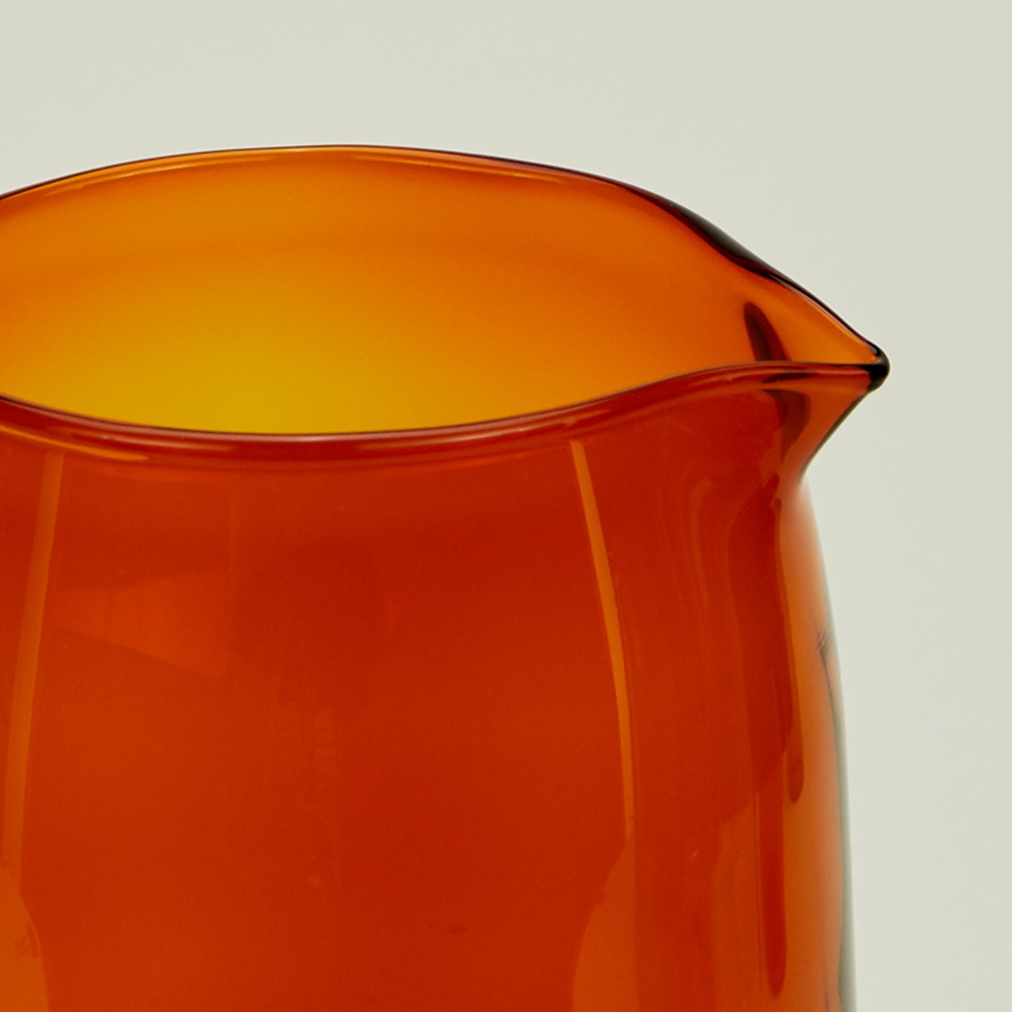 Close up of the rim of the Essential Glassware Pitcher in Terracotta.