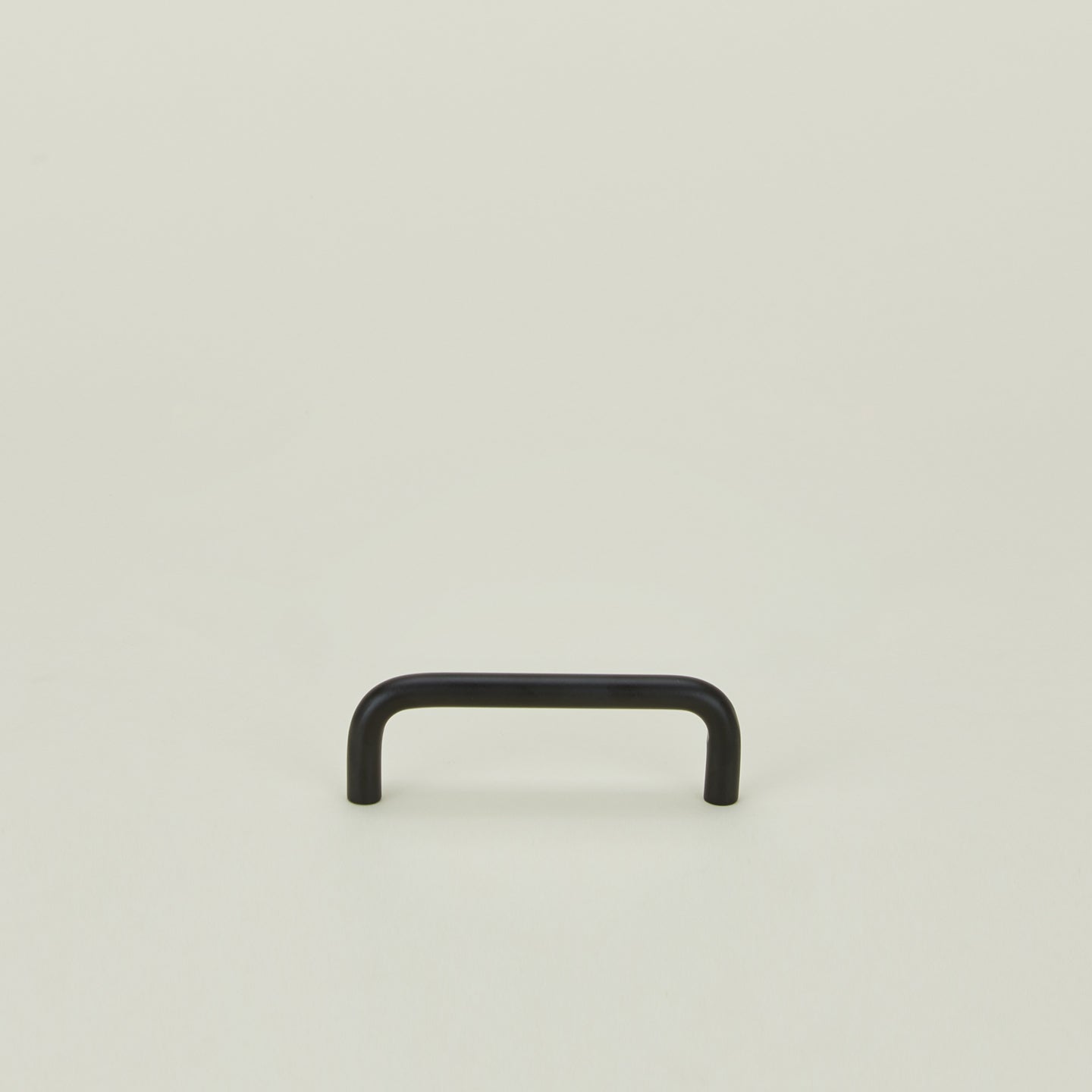 Small drawer pull in Black.