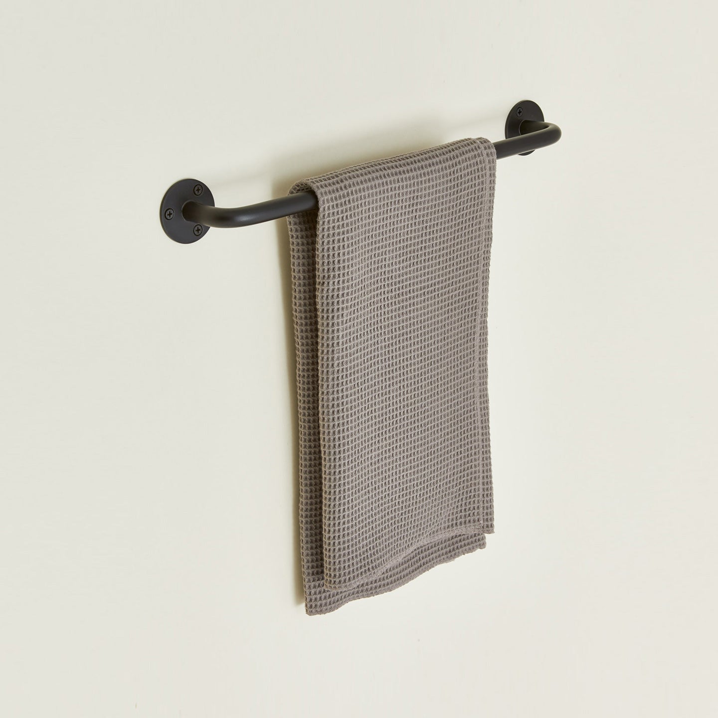 Small towel bar in Black with waffle dish towel.