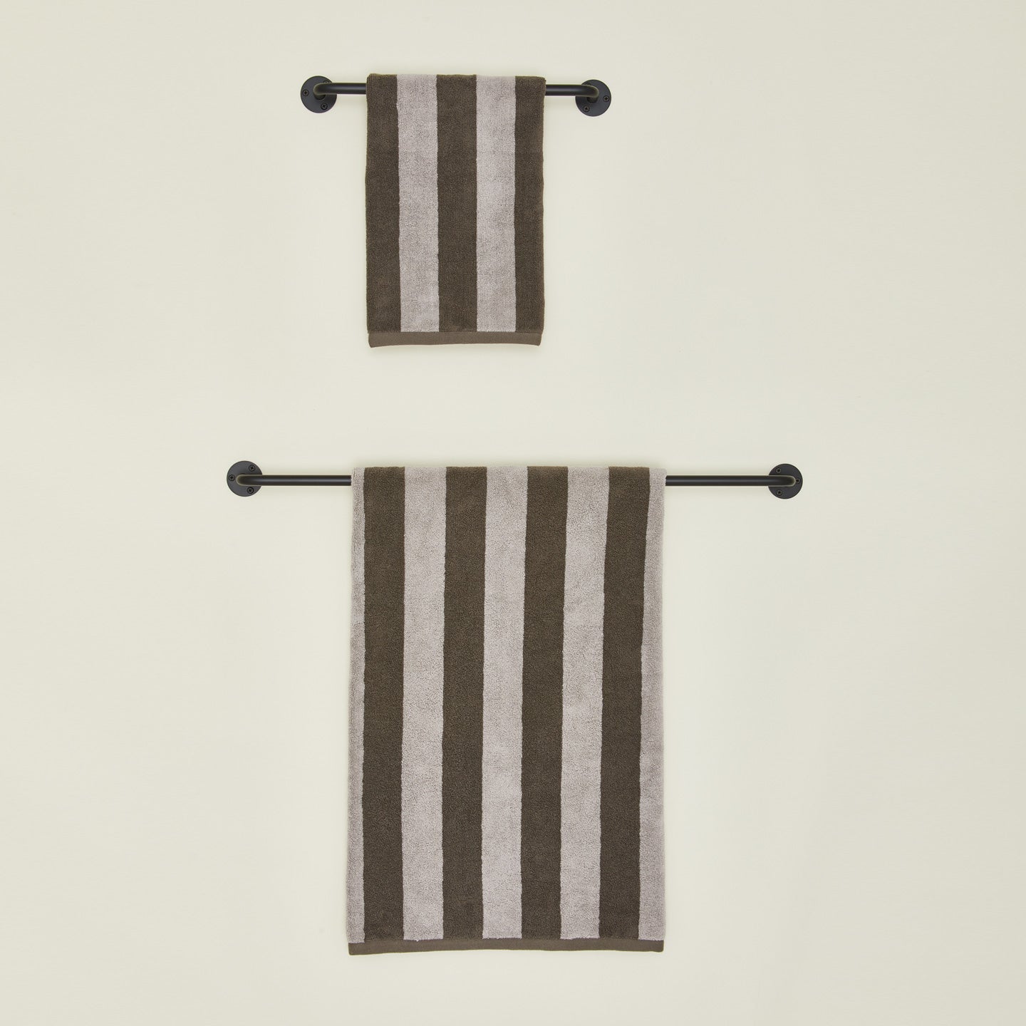 Small and large towel bars in Black with striped towels.